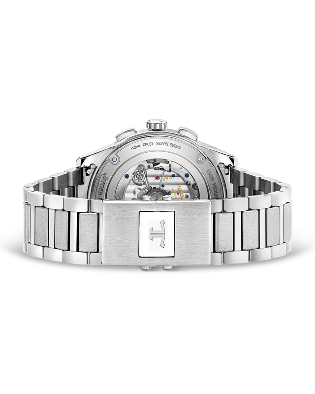A close-up of the Jaeger-LeCoultre Polaris Chronograph’s back reveals its mechanical movement through a transparent case back, while the steel bracelet features a clasp engraved with the letter H.