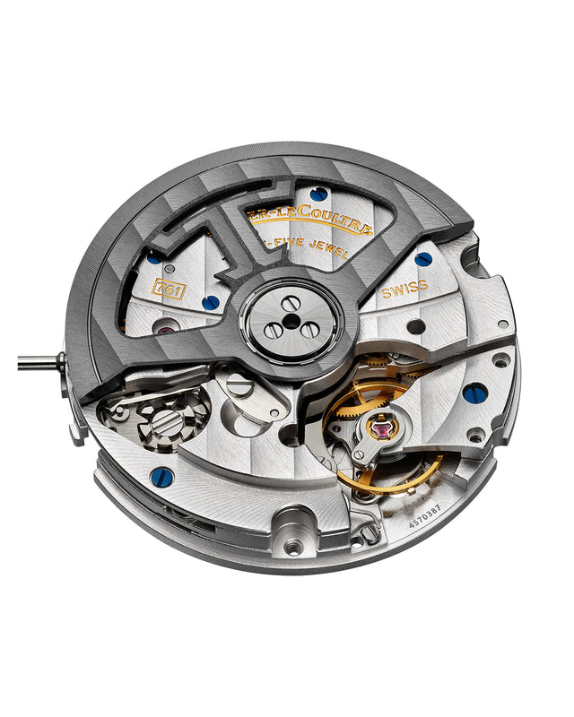 A close-up of the Jaeger-LeCoultre Polaris Chronograph mechanical movement, displaying intricate gears, screws, and engraved metal parts with visible brand markings—part of this distinguished chronograph collection.